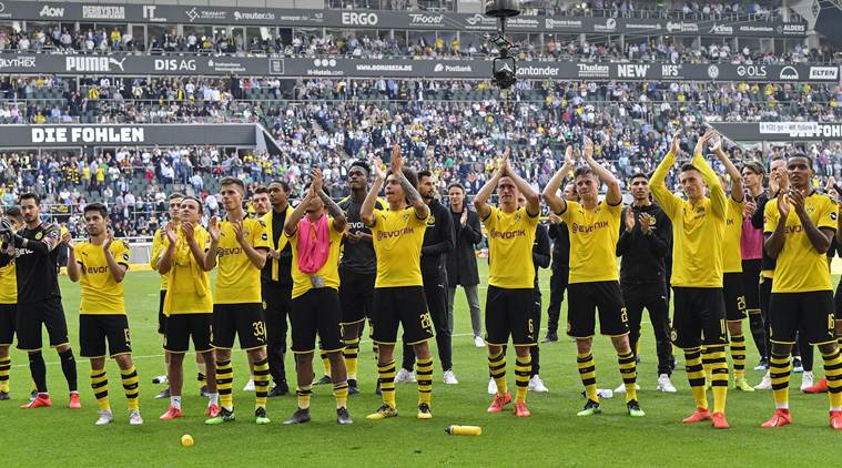 Dortmund's poor run continues with draw at Augsburg, Leipzig win