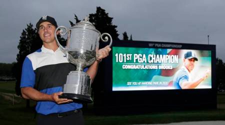 Brooks Koepka poses with the Wanamaker Trophy after winning the PGA Championship golf tournament