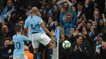Manchester City's Vincent Kompany, right, celebrates after scoring his side's opening goal during the English Premier League soccer match between Manchester City and Leicester City at the Etihad stadium in Manchester