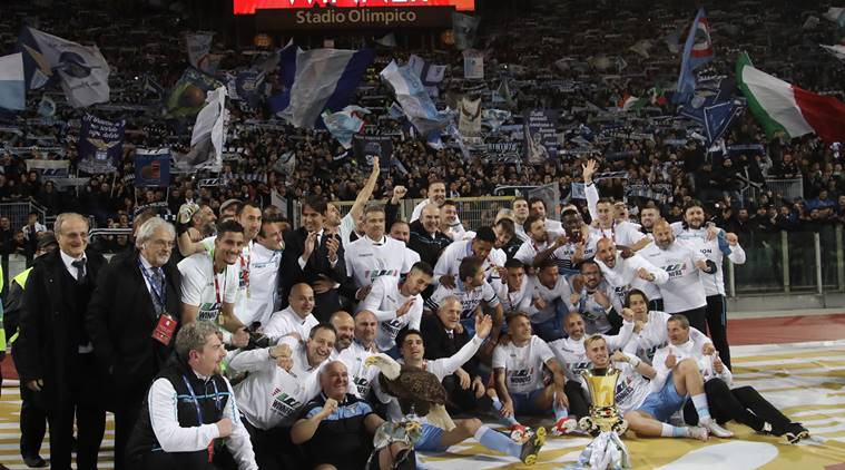 Lazio soccer team poses with the Italian Cup trophy at the end of the final match between Lazio and Atalanta, at the Rome Olympic stadium