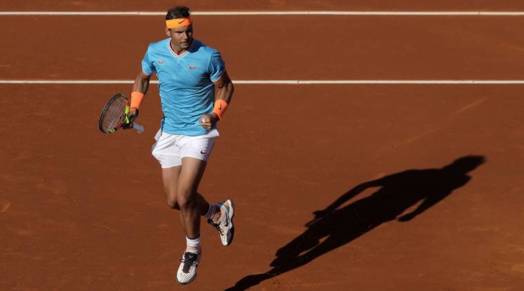 Spain's Rafael Nadal celebrates after scoring a point against Austria's Dominic Thiem during their semifinal match at the Barcelona Open Tennis Tournament in Barcelona, Spain