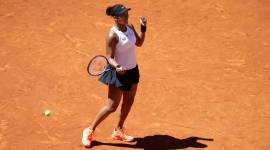 Japan's Naomi Osaka reacts after winning her match against Slovakia's Dominika Cibulkova during the Madrid Open tennis tournament