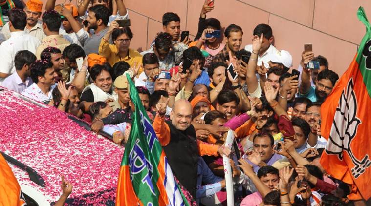 The BJP chief was flanked by a crowd of supporters as the saffron party emerged victorious at many places in the country.