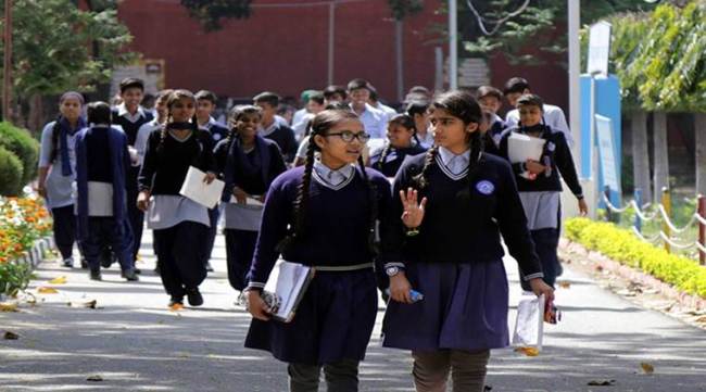 Students of Class 10th coming out from the school after their CBSE English Exam in Sector 18 of Chandigarh on Monday, March 12 2018. Express Photo by Sahil Walia