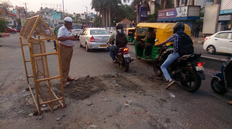 traffic-police-bangalore-potholes
