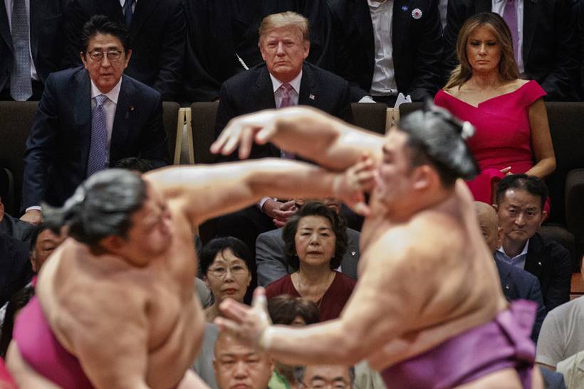 donald trump in japan, trump attends sumo summit photos, trump in japan photos, shinzo abe, japan pm, melania trump, sumo wrestling, world news, indian express