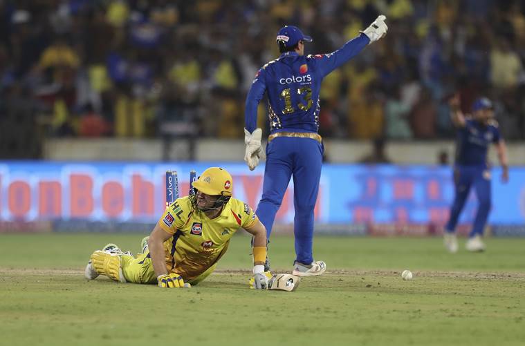 Chennai Super King's Shane Watson, left, falls on the ground after being run-out during the VIVO IPL T20 cricket final match between Mumbai Indians and Chennai Super Kings in Hyderabad