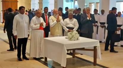 Sri Lanka president holds up umbrella for Modi during rains. See photo