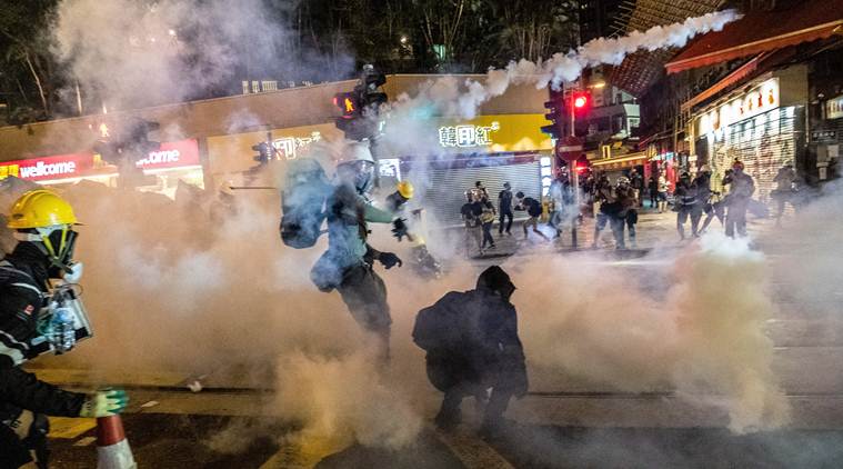 Report of riot charges prompts sudden protest in Hong Kong