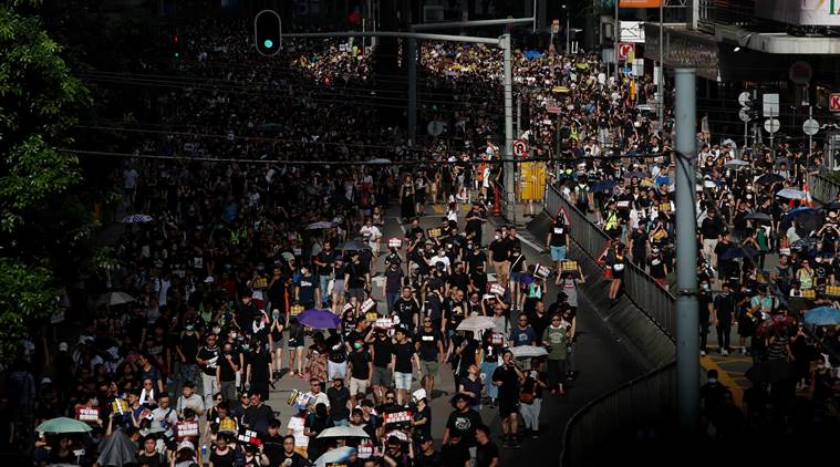 Hong Kong on security alert as thousands march in fresh wave of protests