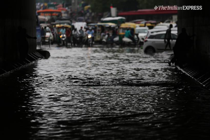 Delhi rains, delhi waterlogged, old delhi rains, raons in old delhi, waterlogged roads in old delhi, delhi weather, fdelhi weather forecast, delhi rain photos, delhi rain pics, delhi rain pictures, old delhi pictures, indian express