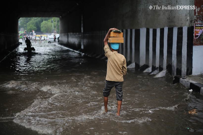 Delhi rains, delhi waterlogged, old delhi rains, raons in old delhi, waterlogged roads in old delhi, delhi weather, fdelhi weather forecast, delhi rain photos, delhi rain pics, delhi rain pictures, old delhi pictures, indian express