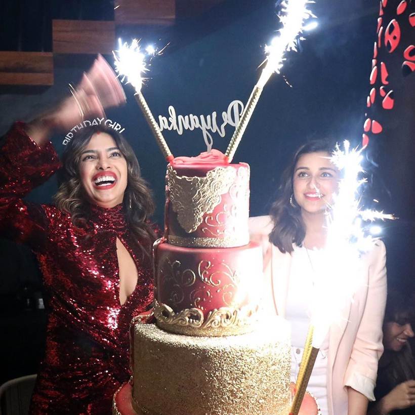 Priyanka Chopra and Nick Jonas pose with the latter's big birthday cake |  Filmfare.com
