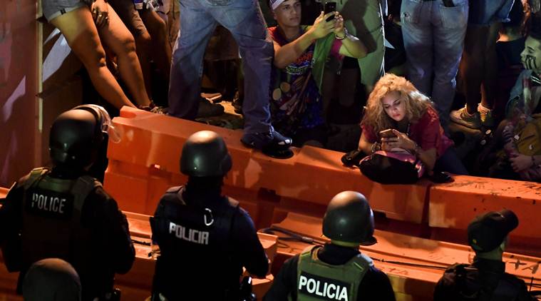 Riding horses and banging drums, Puerto Ricans demand that governor quit