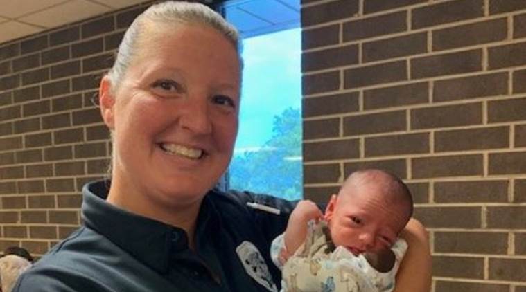 cop rescues baby from choking, cop rescues two month old baby fro choking, Trending, Indian Express news, Latest news