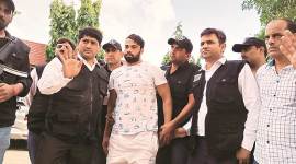 delhi Gurgaon gangster is arrested after landing in Delhi