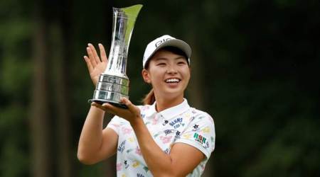 Golf - Women’s British Open - Woburn Golf Club, Milton Keynes, Britain - August 4, 2019   Japan's Hinako Shibuno celebrates with trophy after making a birdie putt on the 18th hole to win the Women’s British Open   Action Images via Reuters/Peter Cziborra