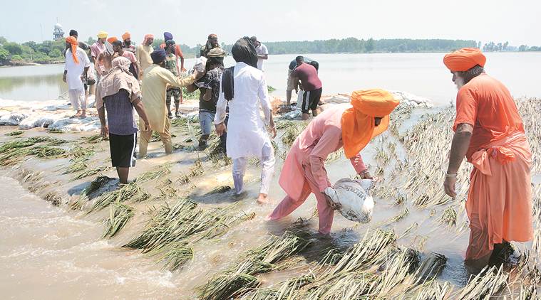 punjab floods, punjab karsewaks, punjab rains, floods in punjab, rains in punjab, punjab monsoon, punjab floods death toll, punjab rains death toll, india news, Indian Express