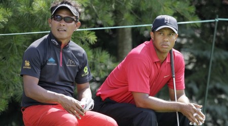 FILE - In this June 6, 2010, file photo, Tiger Woods, right, and Thongchai Jaidee, of Thailand, sit on a bench in the 17th tee box during the fourth round of the Memorial golf tournament at Muirfield Village Golf Club in Dublin, Ohio. Woods has had a profound effect on golf in his mother's native Thailand. (AP Photo/Amy Sancetta, File)