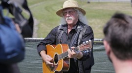 Woodstock veteran Arlo Guthrie plays a song at the original site of the 1969 Woodstock Music and Arts Fair in Bethel