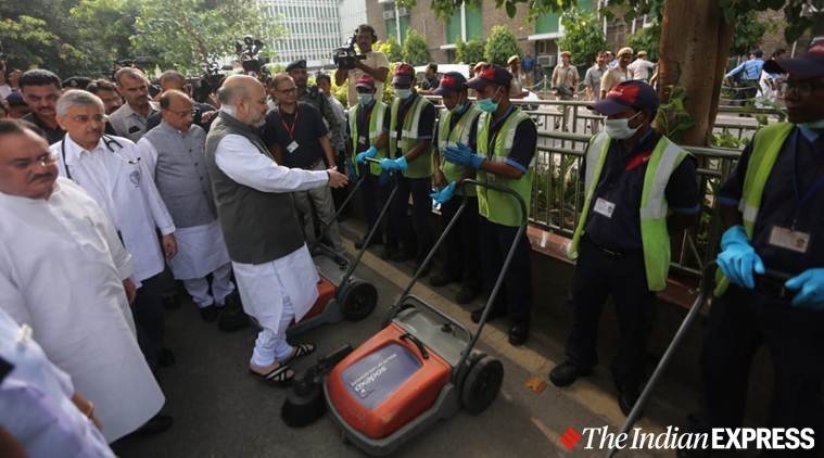 Amit Shah, Amit Shah mops floor, Amit Shah Aiims, Modi birthday, Seva saptah Modi birthday, indian express