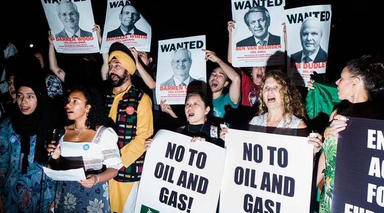 Oil giants, under fire from climate activists and investors, mount a defense