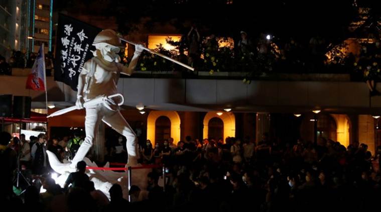 Hong Kong protesters gather in renewed protest as night falls