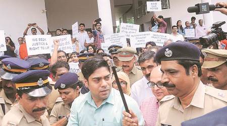 Residents of the apartment complexes in Maradu protest during the visit by Chief Secretary Tom Jose. (Express)