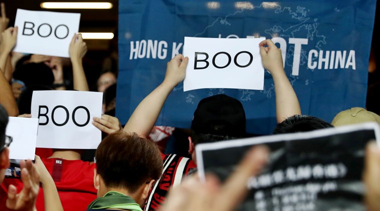 Hong Kong protesters boo Chinese anthem, as leader warns against interference