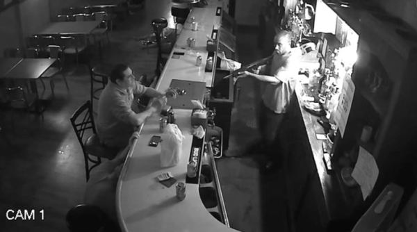 man remains calm during armed robbery, bar robbery man remains cool, st louis man lights cigarette at gunpoint, viral video, trending, indian express news