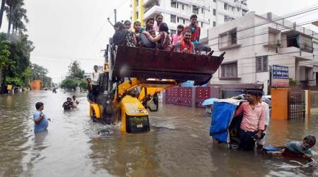 EDS PLS TAKE NOTE OF THIS PTI PICK OF THE DAY::::::::Patna: Patna Muncipal Corporation (PMC) officials in a JCB rescue to people from a water logged area after heavy rainfall  in Patna, Sept. 28, 2019. (PTI Photo)(PTI9_28_2019_000065A)(PTI9_28_2019_000171A)