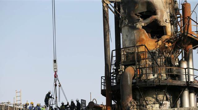 Workers are seen at the damaged site of Saudi Aramco oil facility in Abqaiq, Saudi Arabia, September 20, 2019. REUTERS/Hamad l Mohammed
