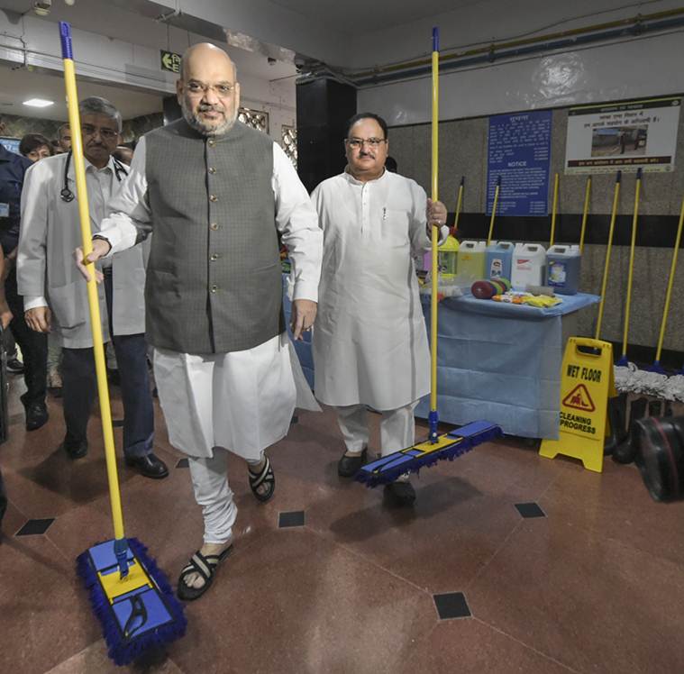 Amit Shah, Amit Shah mops floor, Amit Shah Aiims, Modi birthday, Seva saptah Modi birthday, indian express