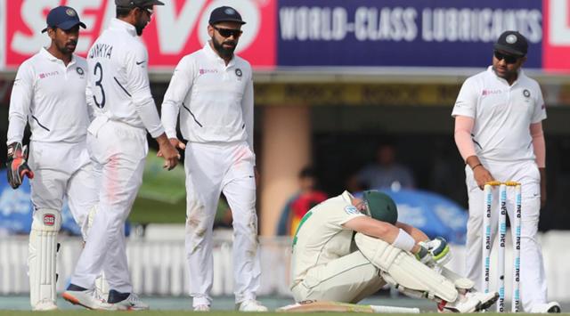 Indian players walk to check on South Africa's Dean Elgar. (AP Photo)