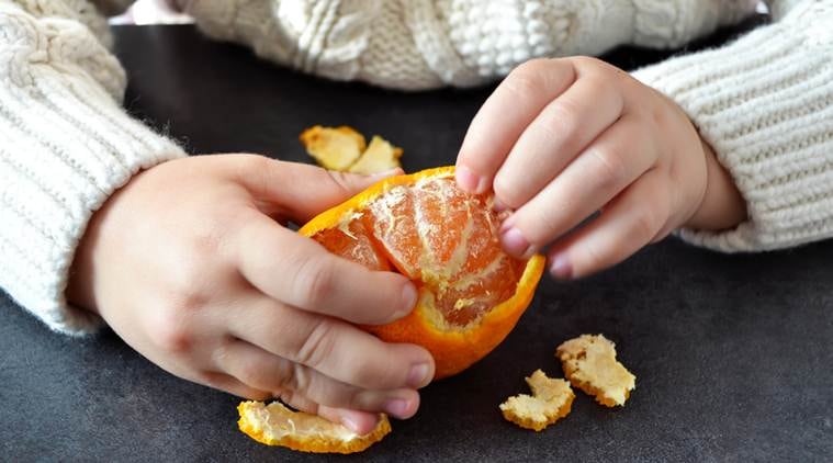 Oranges are added to balance the stones in the given weight