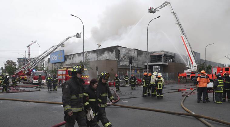 Three die after supermarket set on fire, flights out of Santiago delayed due to Chile riots