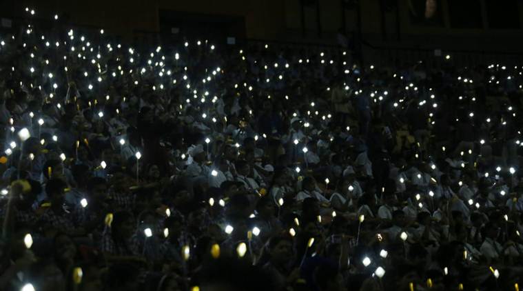 School students light solar lamps on Mahatma Gandhi's 150th birth anniversary