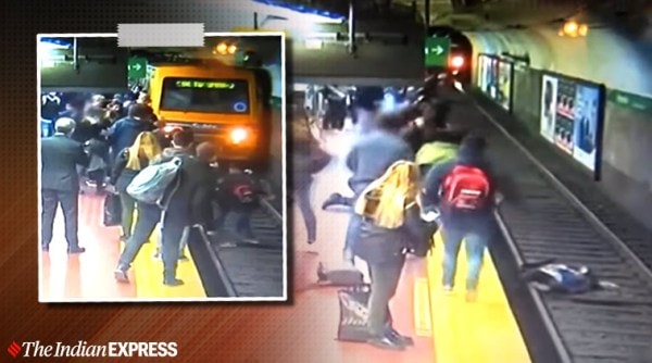 woman falls on subway tracks, woman train tracks viral video, woman pushed on railway track, woman viral video, trending, indian express, indian express news