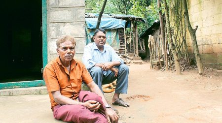 Woods are lovely: Mahadev (in blue) and Karanaketha Gowda recount the Soligas’ struggle to get their forest rights recognised. (Source: Arathi Menon)
