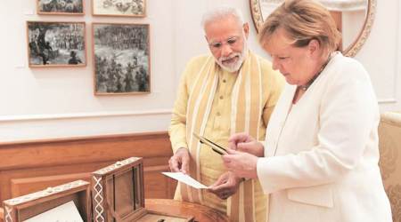 Angela Merkel, Narendra Modi, Jharkhan Elections, Angela Merkel India, NTRO Satish Jha, Delhi Confidential, indian express news