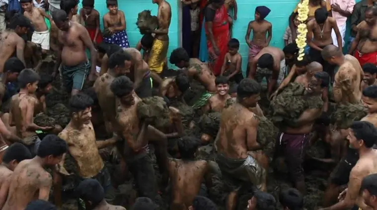 Indian version of La Tomatina': Video of people smearing cow dung on each  other goes viral | Trending News,The Indian Express