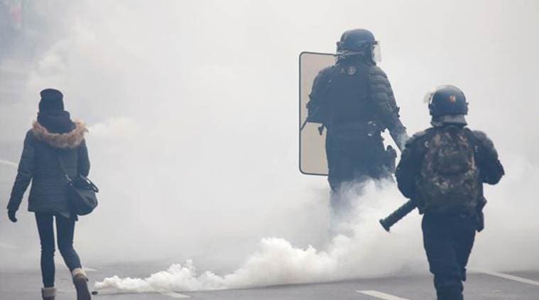 France: Tear gas fired as yellow vests attempt comeback