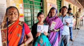 People queue up at a polling station