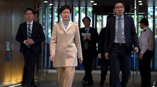 Hong Kong leader Carrie Lam heads for Beijing as pressure mounts at home