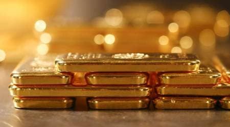 Gold scales 7-year high on rising economic worries, Fed stimulus, SPDR Gold holdings rise to highest since June 2013, global gold price news tuesday, business news india, commodity market news, indian express business news