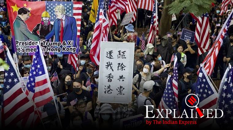 Protesters hold banners and American flags during a rally outside the US Consulate in Hong Kong on December 1. (AP photo)