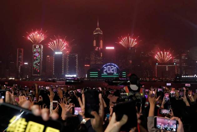 Cheers, tears, prayers for 2020: How new year is being ushered in across the world