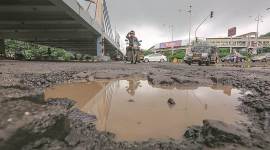 Potholes in mumbai, mubai potholes, under construction roads in Mumbai, roads in mumbai, road accidents in mumbai, mumbai news, mumbai city news, indian express news