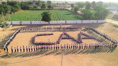 Rajkot news, rajkot city news, gujarat news, School students form CAA human chain, indian express news