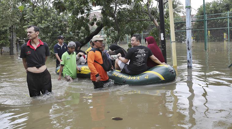 INDONESIA floods, jakarta news, indonesia flood damage, indonesia flood photos, world news, indian express